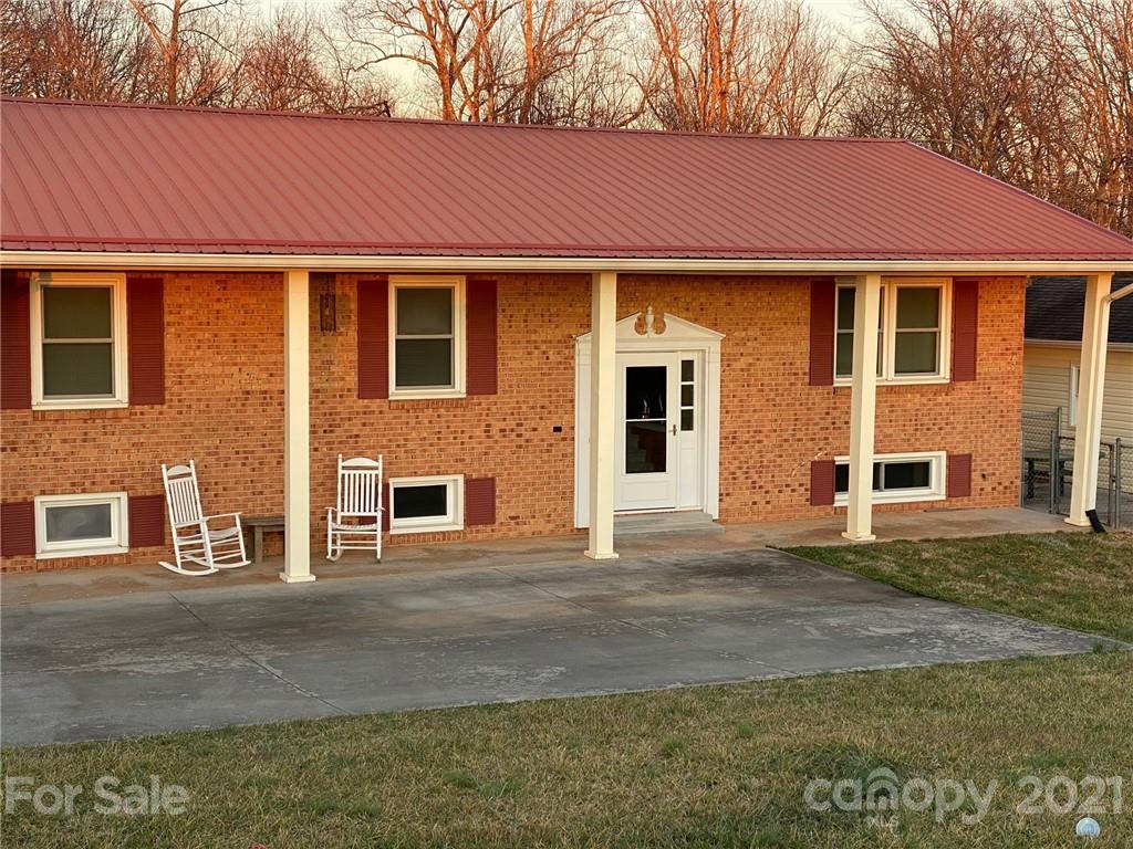 4903 Horseshoe Bend Road Hudson, NC 28638 - Photo 26 of 26 a front view of a house with a yard and garage