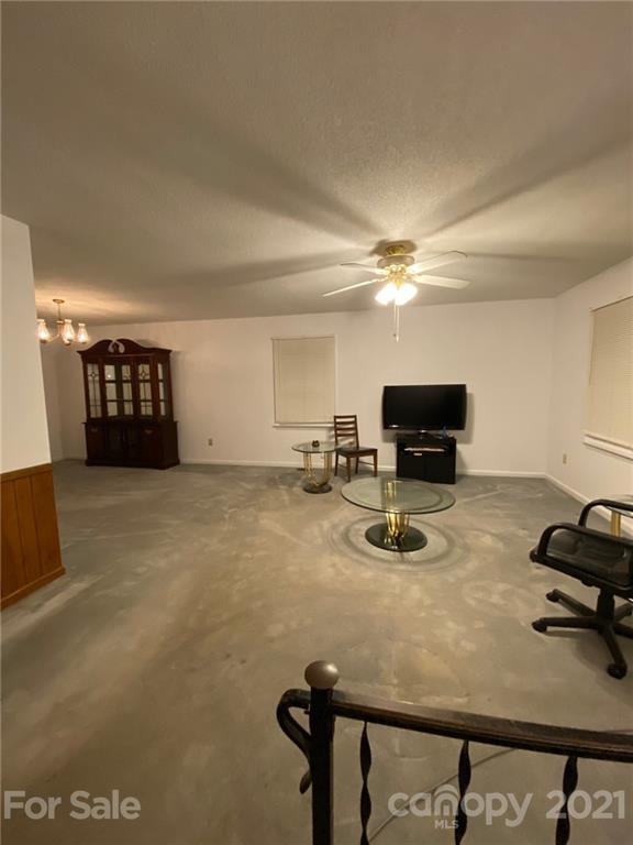 4903 Horseshoe Bend Road Hudson, NC 28638 - Photo 6 of 26 a room with furniture and a flat screen tv