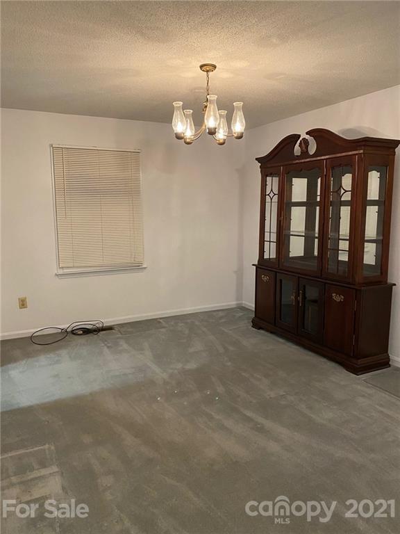 4903 Horseshoe Bend Road Hudson, NC 28638 - Photo 7 of 26 a view of an empty room with a window