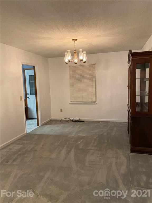 4903 Horseshoe Bend Road Hudson, NC 28638 - Photo 8 of 26 a view of a room with a chandelier