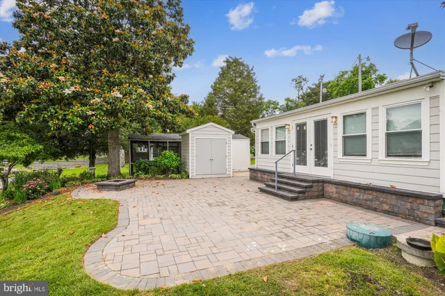 a backyard of a house with seating space