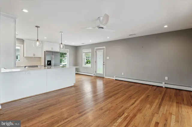 a view of kitchen with wooden floor and window