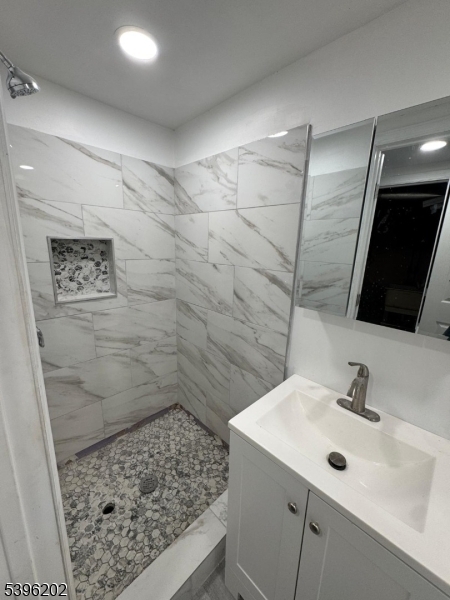 37 Irving Street Carteret, NJ 07008 - Photo 8 of 10 a bathroom with a sink and a mirror
