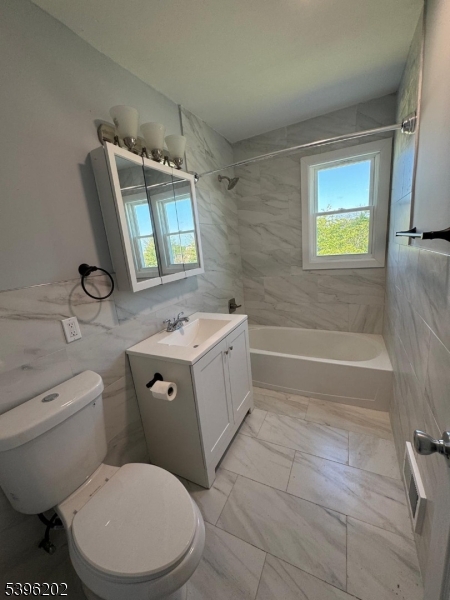 37 Irving Street Carteret, NJ 07008 - Photo 9 of 10 a bathroom with a toilet sink and mirror
