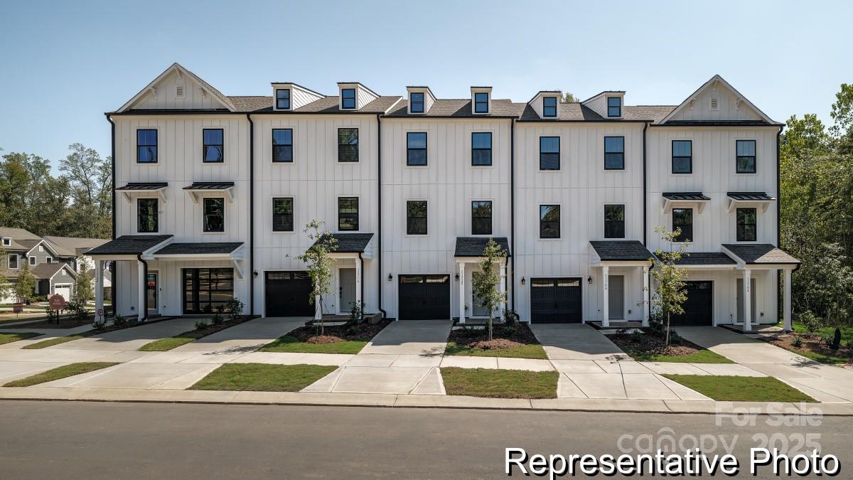 a view of a white building among the street