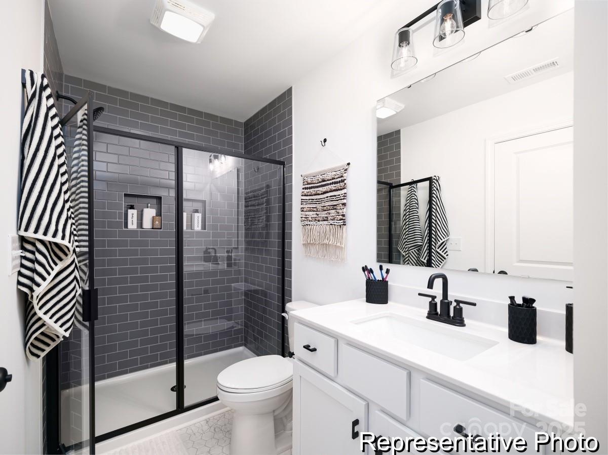 405 Drawbar Drive, Unit 131 Clover, SC 29710 - Photo 22 of 28 a bathroom with a sink toilet and shower