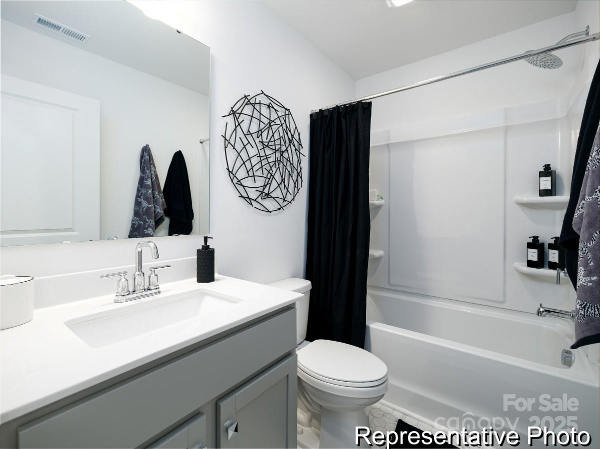405 Drawbar Drive, Unit 131 Clover, SC 29710 - Photo 27 of 28 a bathroom with a sink toilet and shower