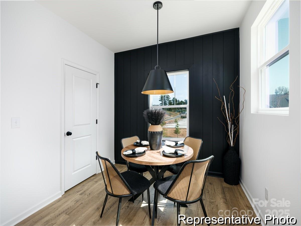 405 Drawbar Drive, Unit 131 Clover, SC 29710 - Photo 8 of 28 a dining room with furniture and wooden floor