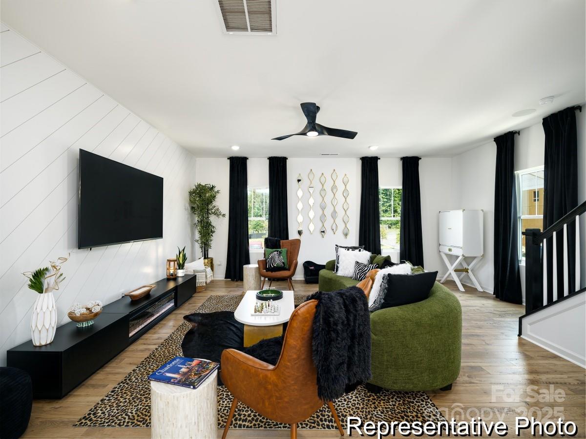 405 Drawbar Drive, Unit 131 Clover, SC 29710 - Photo 9 of 28 a living room with furniture and a flat screen tv