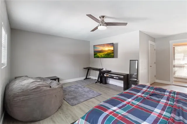 a bedroom with a bed and a chandelier