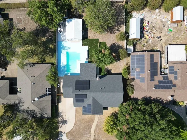an aerial view of multiple houses with yard
