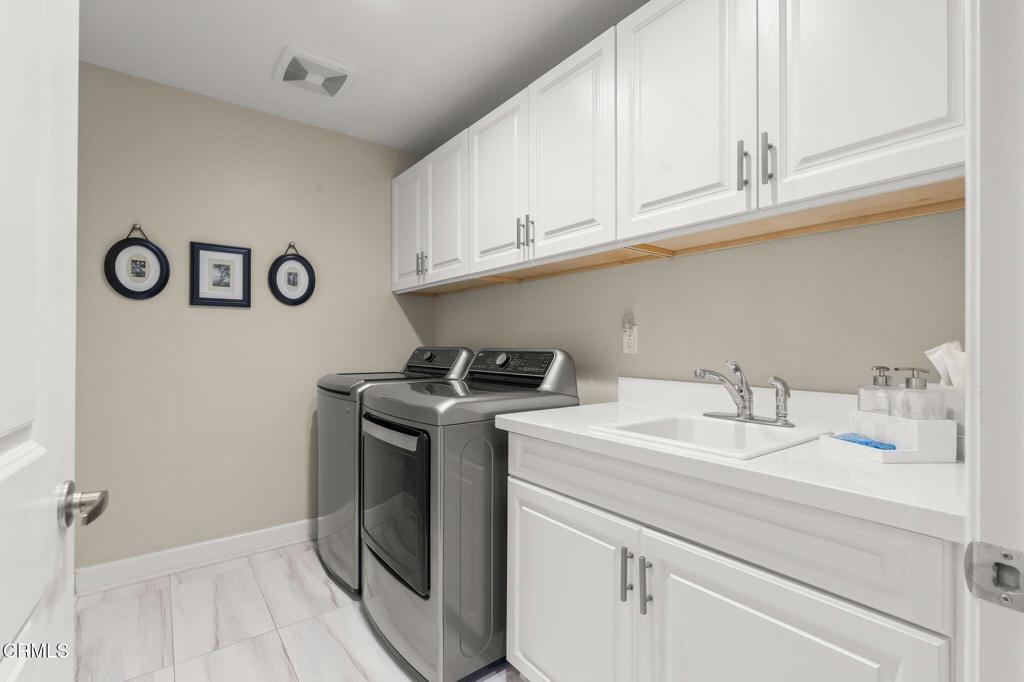 3729 Islander Walk Oxnard, CA 93035 - Photo 20 of 46 a utility room with sink dryer and washer