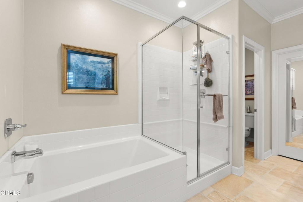 3729 Islander Walk Oxnard, CA 93035 - Photo 23 of 46 a bathroom with a bathtub and a shower
