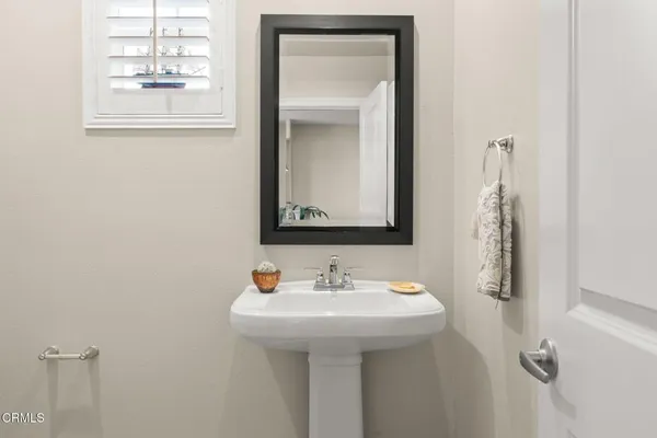 a hallway with windows and wooden floor