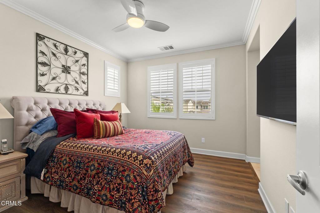 3729 Islander Walk Oxnard, CA 93035 - Photo 28 of 46 a bedroom with bed and wooden floor