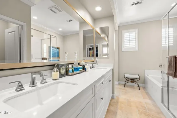 a view of a hallway with staircase and white walls