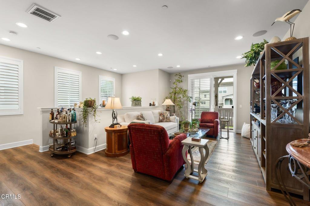 3729 Islander Walk Oxnard, CA 93035 - Photo 10 of 46 a living room with furniture a window and gym equipment