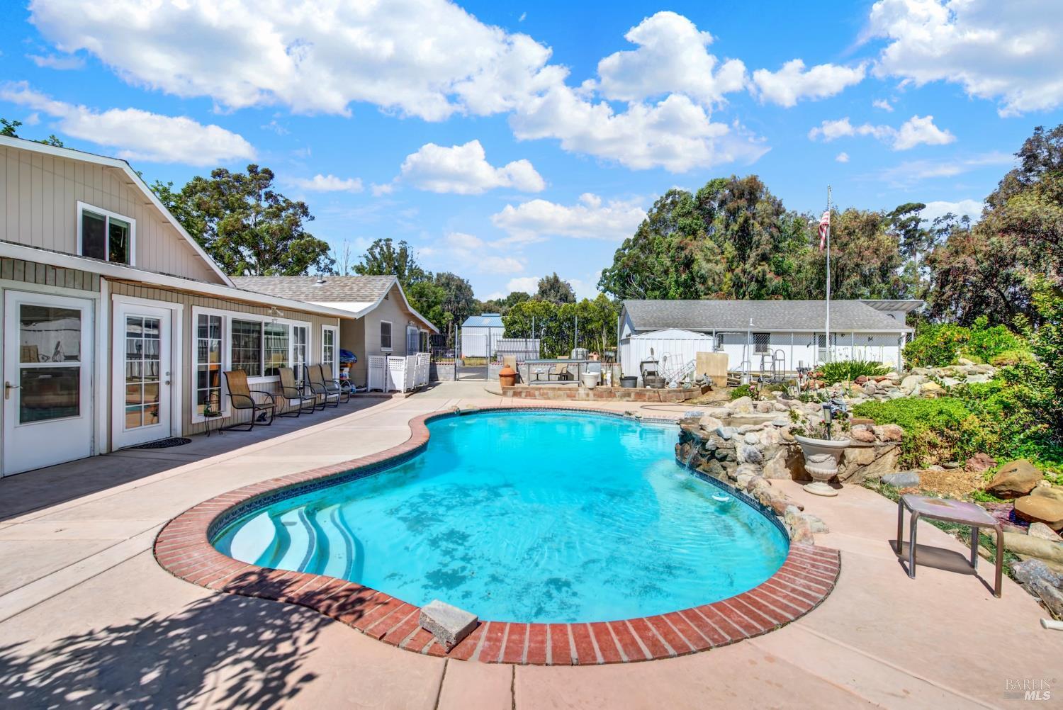 4851 Udell Road Vacaville, CA 95688 - Photo 31 of 65 a view of a swimming pool with a patio
