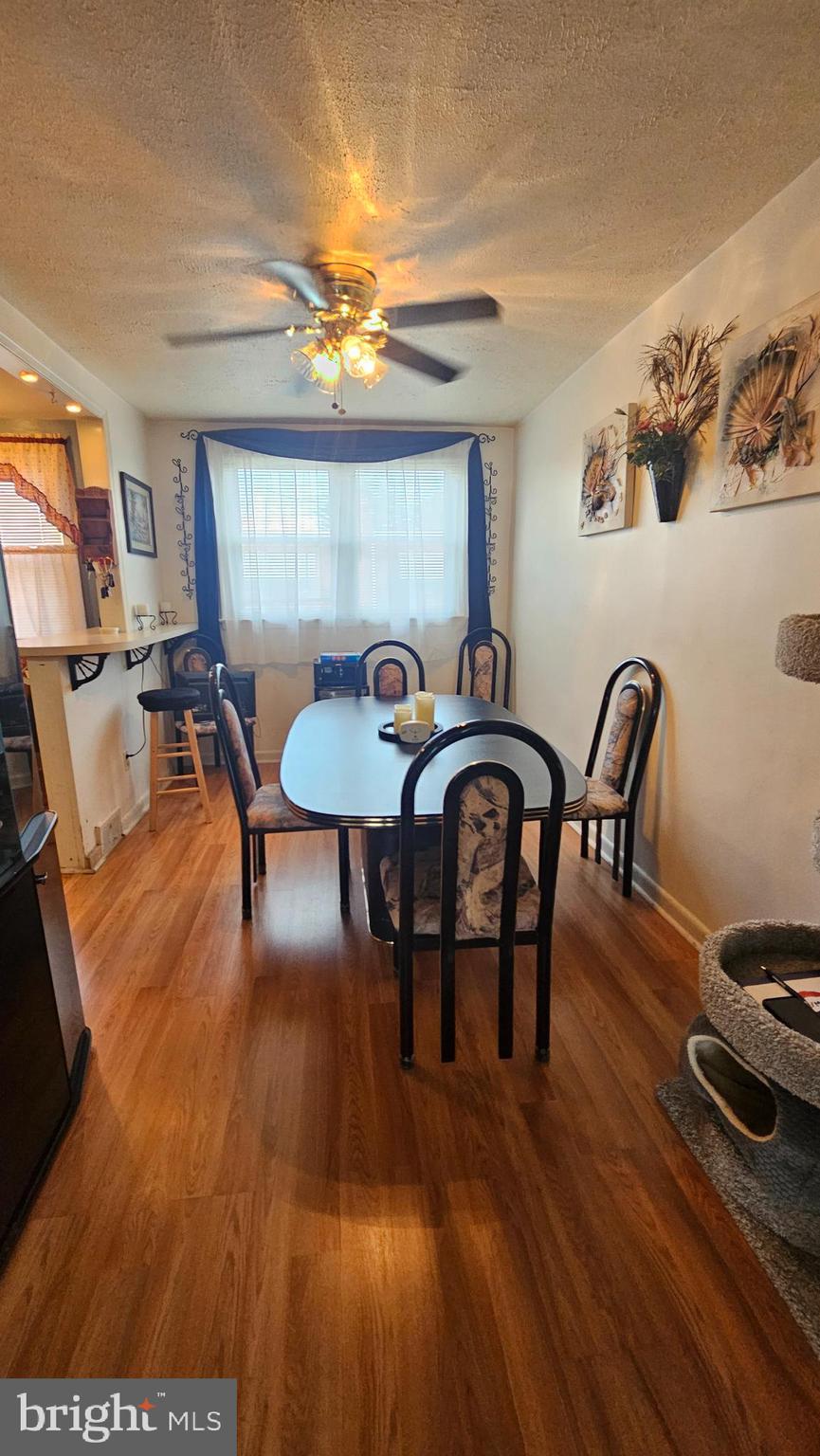 7829 Horrocks Street Philadelphia, PA 19152 - Photo 13 of 46 a dining room with furniture a chandelier and wooden floor