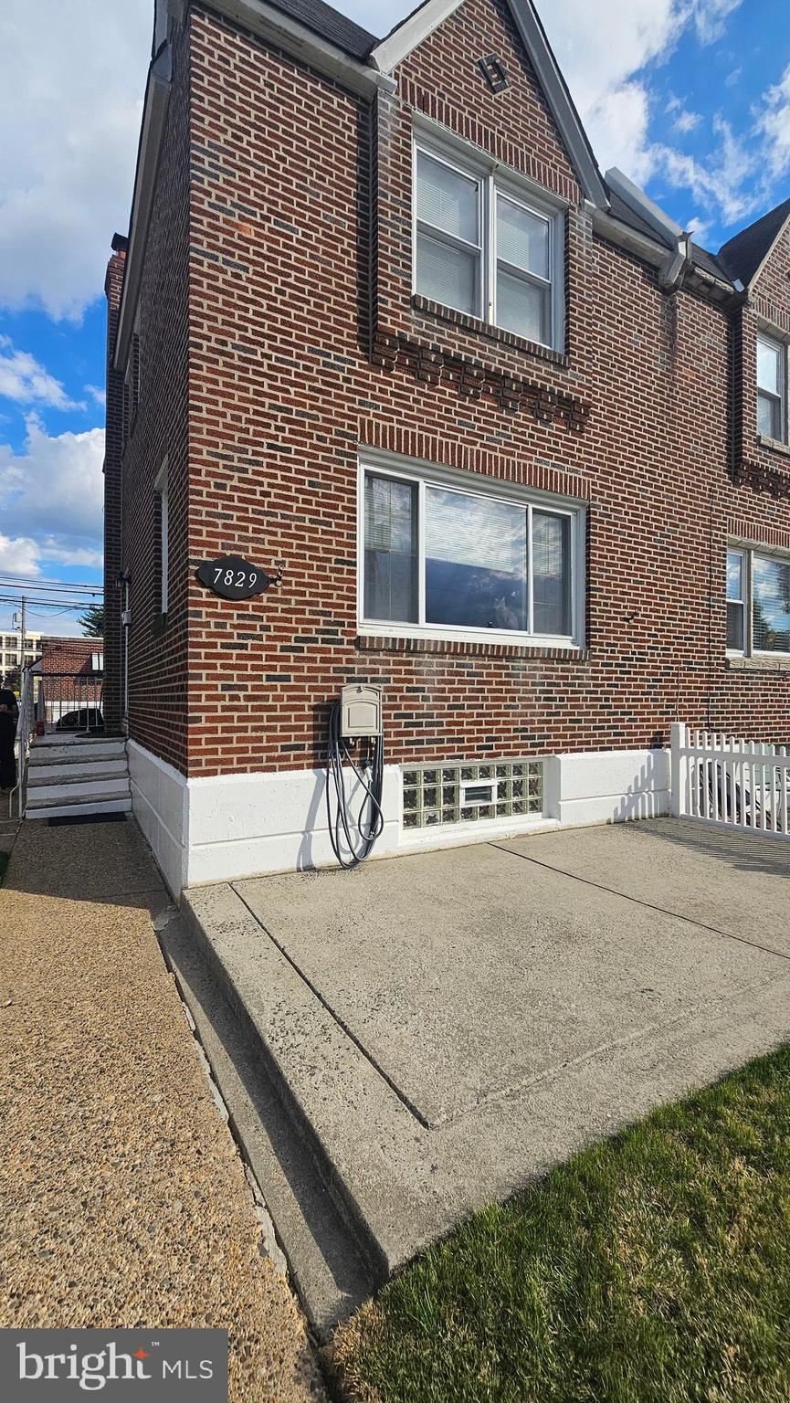 7829 Horrocks Street Philadelphia, PA 19152 - Photo 2 of 46 a front view of a house with a yard