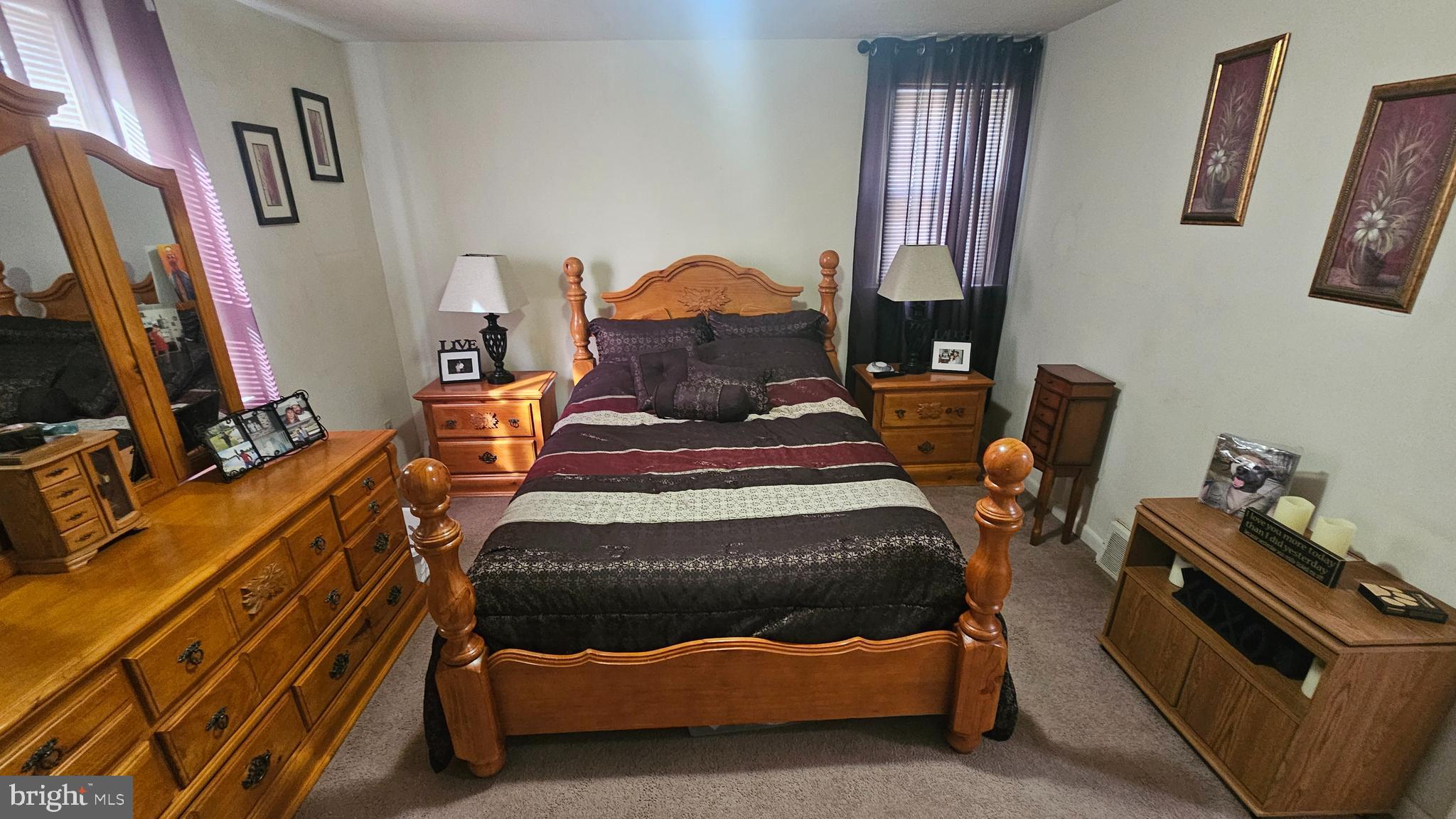 7829 Horrocks Street Philadelphia, PA 19152 - Photo 24 of 46 a bed room with furniture and a flat screen tv