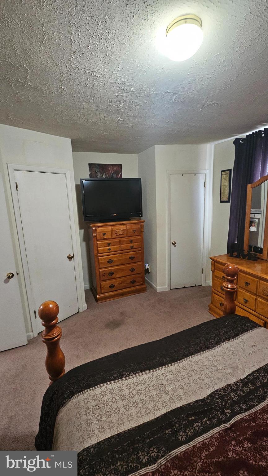 7829 Horrocks Street Philadelphia, PA 19152 - Photo 25 of 46 a bedroom with a bed and wooden floor