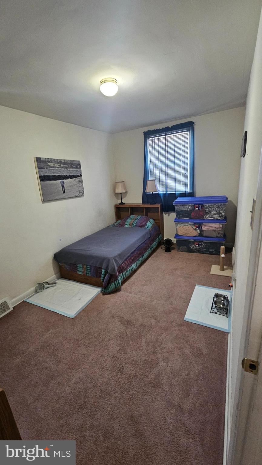 7829 Horrocks Street Philadelphia, PA 19152 - Photo 30 of 46 a bedroom with furniture and a window