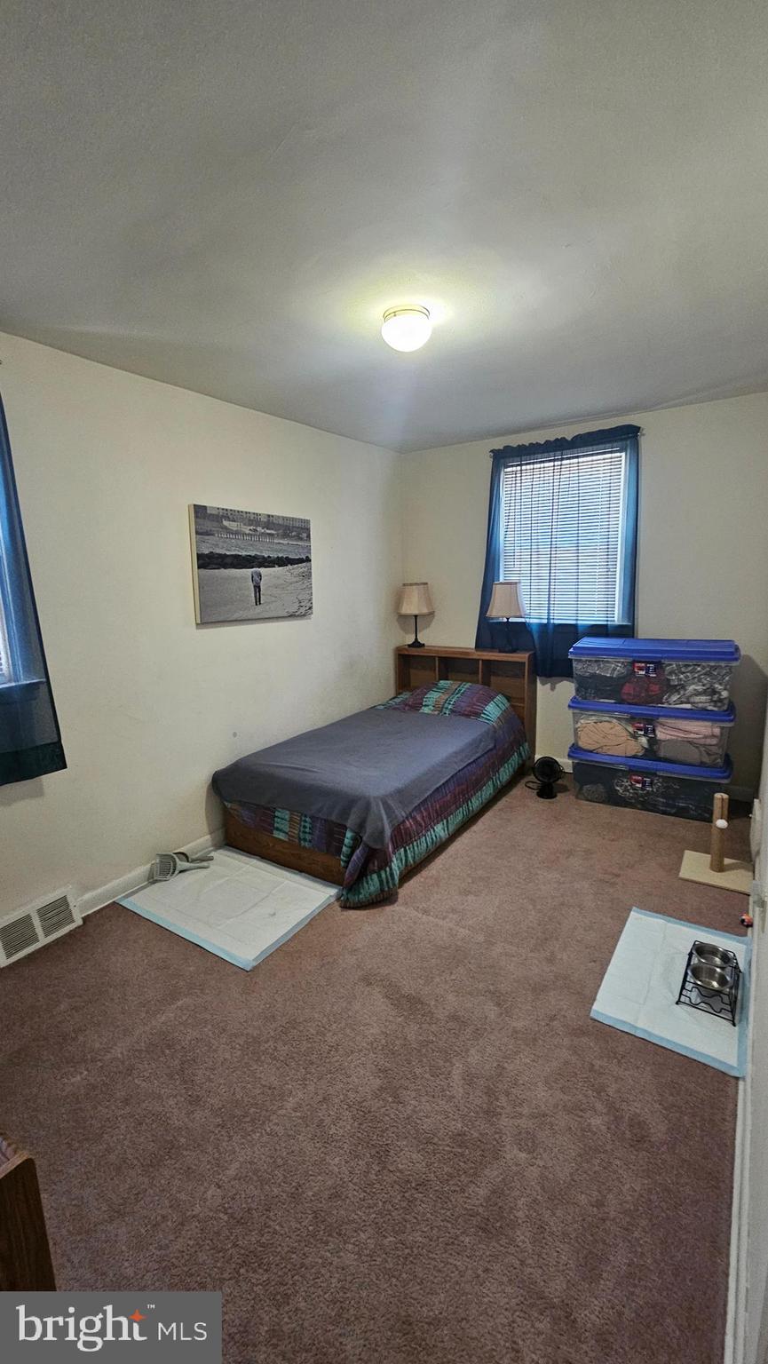 7829 Horrocks Street Philadelphia, PA 19152 - Photo 31 of 46 a bedroom with furniture and a window