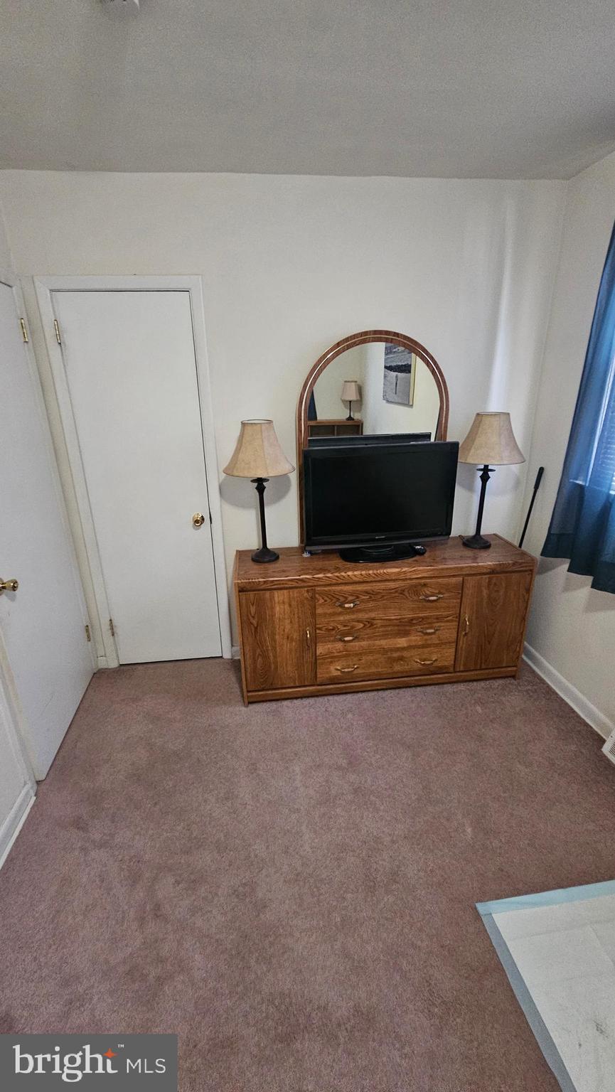 7829 Horrocks Street Philadelphia, PA 19152 - Photo 32 of 46 a living room with furniture and a table