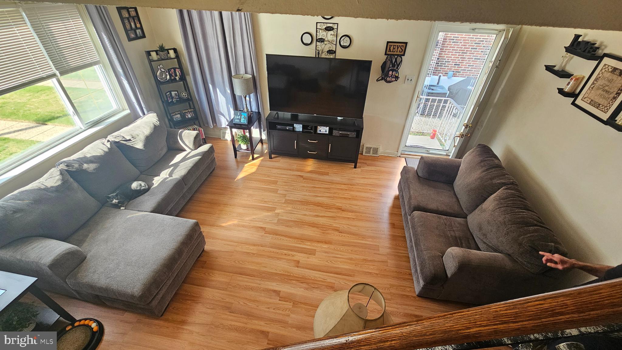 7829 Horrocks Street Philadelphia, PA 19152 - Photo 5 of 46 a living room with furniture and a flat screen tv