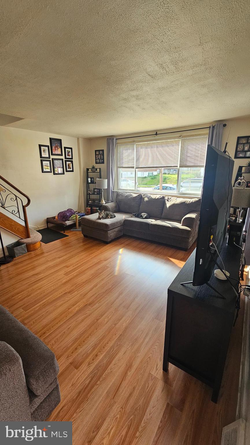 7829 Horrocks Street Philadelphia, PA 19152 - Photo 7 of 46 a living room with furniture window and wooden floor
