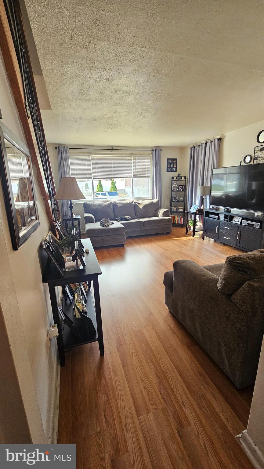 7829 Horrocks Street Philadelphia, PA 19152 - Photo 8 of 46 a living room with furniture and a table