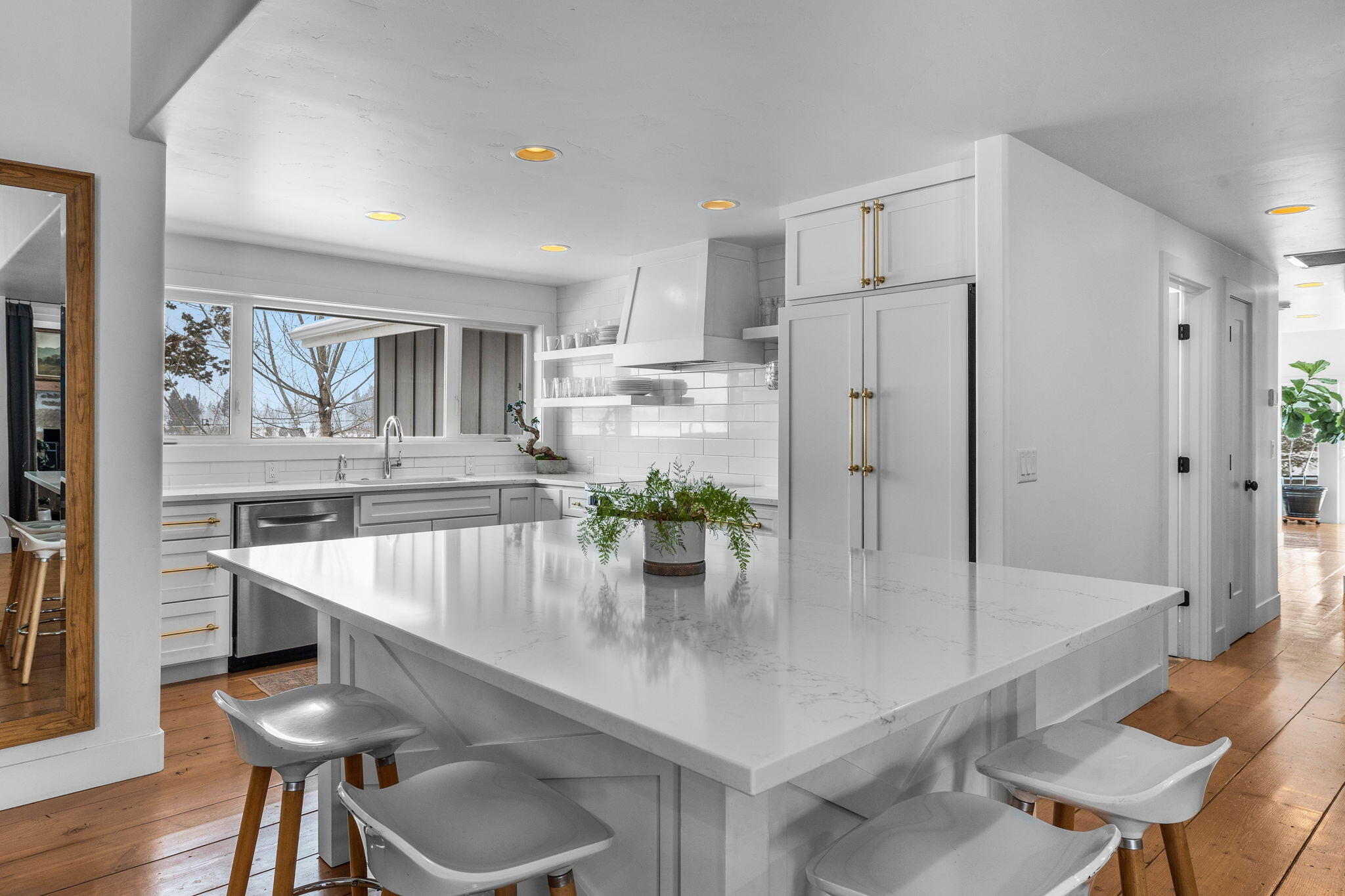 63210 Overtree Road Bend, OR 97701 - Photo 4 of 9 a kitchen with stainless steel appliances a table chairs and a refrigerator