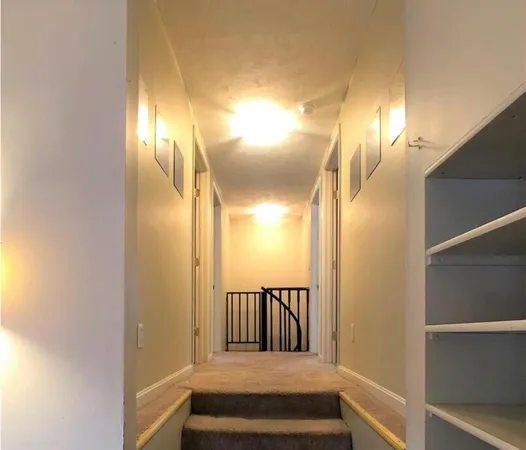 a view of entryway and hall with a window