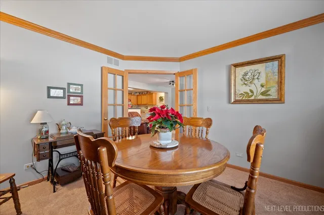 a dining room with furniture and window