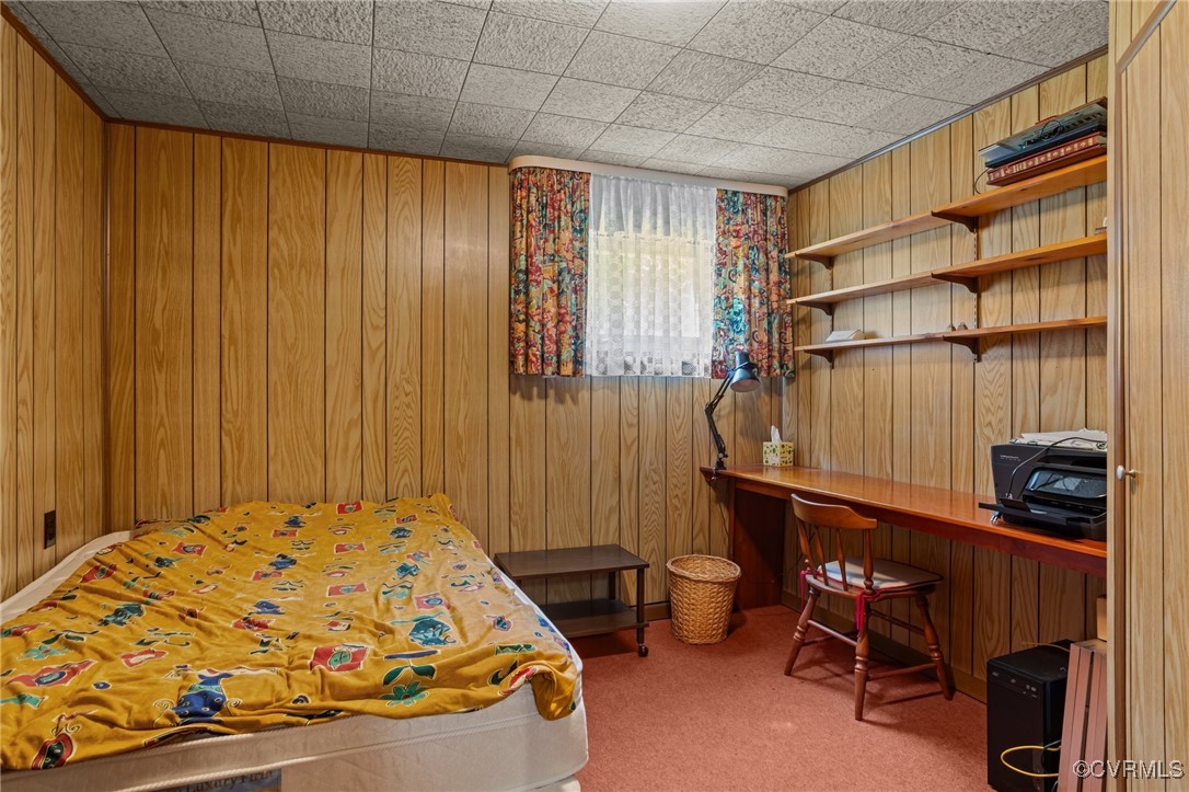 4976 Windsor Road Sandston, VA 23150 - Photo 27 of 41 Carpeted bedroom featuring wood walls and a desk
