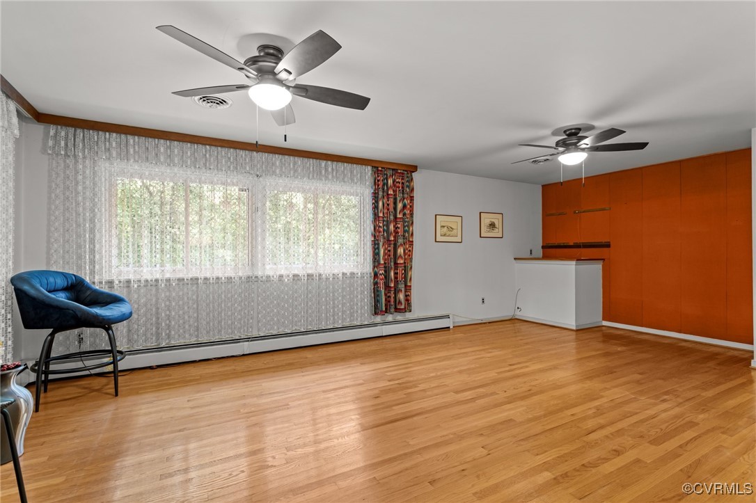 4976 Windsor Road Sandston, VA 23150 - Photo 8 of 41 Unfurnished living room with ceiling fan, baseboar