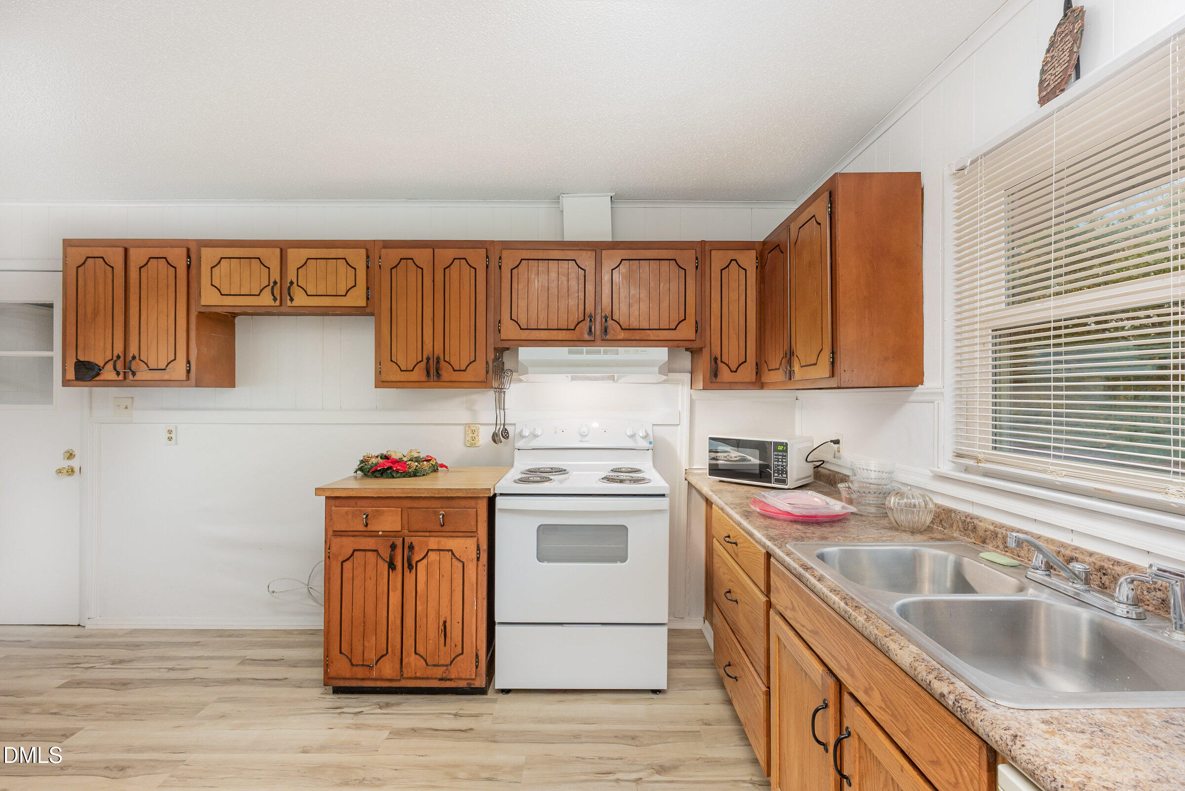 3228 Julian Drive Raleigh, NC 27604 - Photo 11 of 29 a kitchen with a sink cabinets and stainless steel appliances