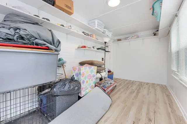 a bedroom with furniture and a chandelier