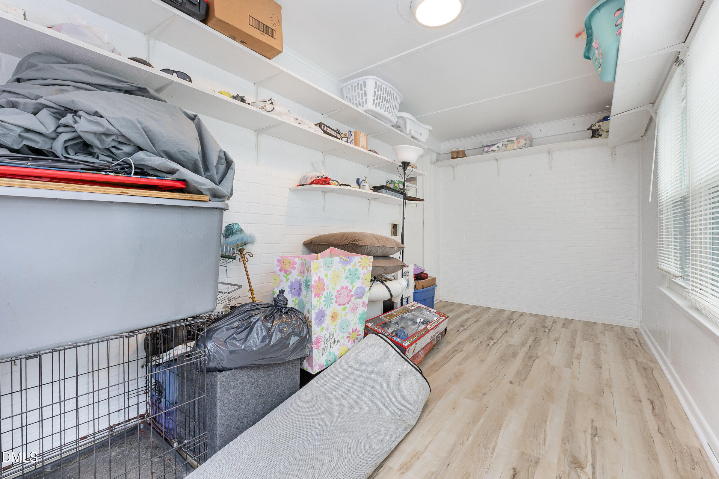 3228 Julian Drive Raleigh, NC 27604 - Photo 14 of 29 a bedroom with furniture and a chandelier