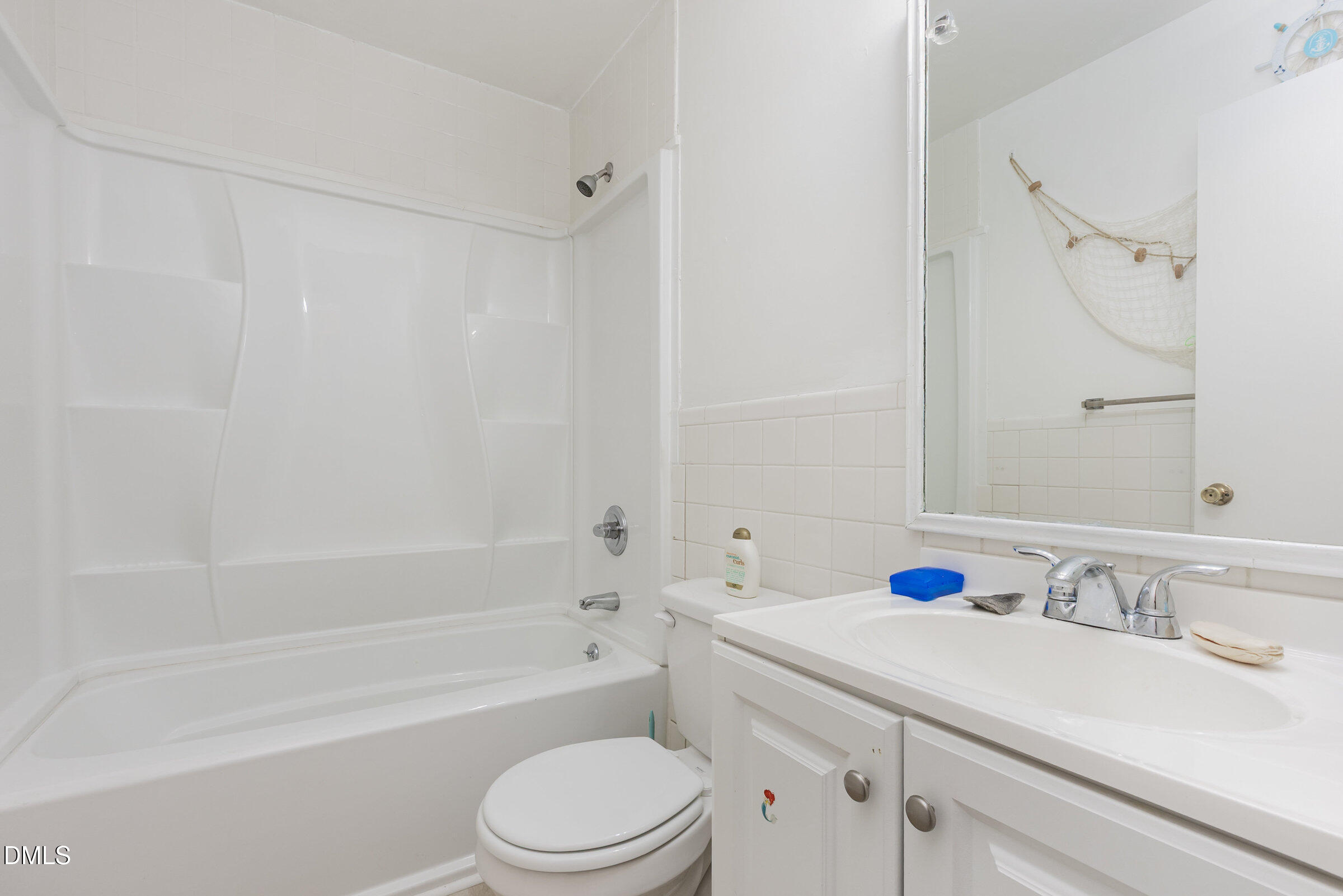 3228 Julian Drive Raleigh, NC 27604 - Photo 15 of 29 a bathroom with a sink a toilet and a bathtub