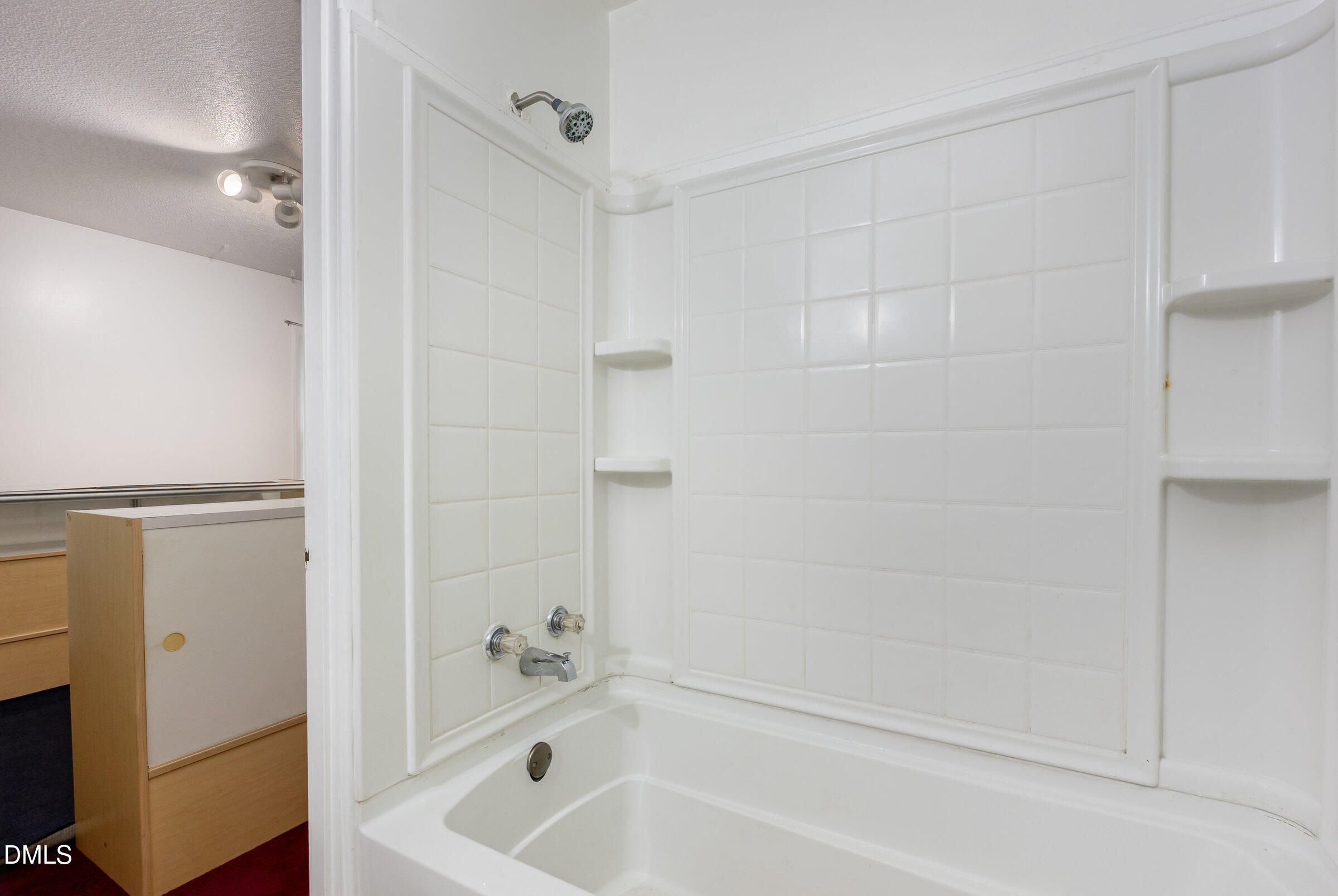 3228 Julian Drive Raleigh, NC 27604 - Photo 22 of 29 a bathroom with a bathtub and a shower