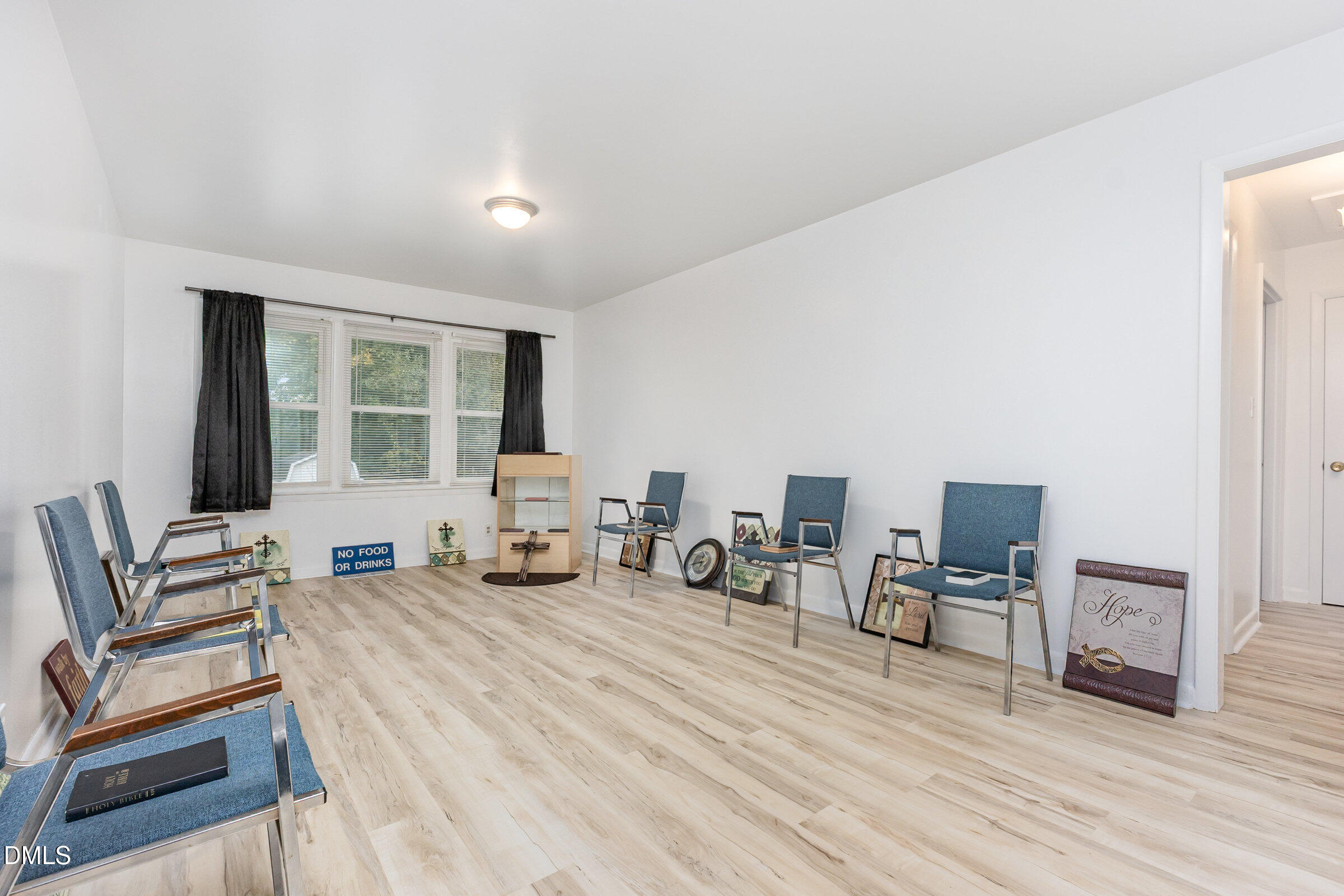 3228 Julian Drive Raleigh, NC 27604 - Photo 5 of 29 a bedroom with furniture and a large window