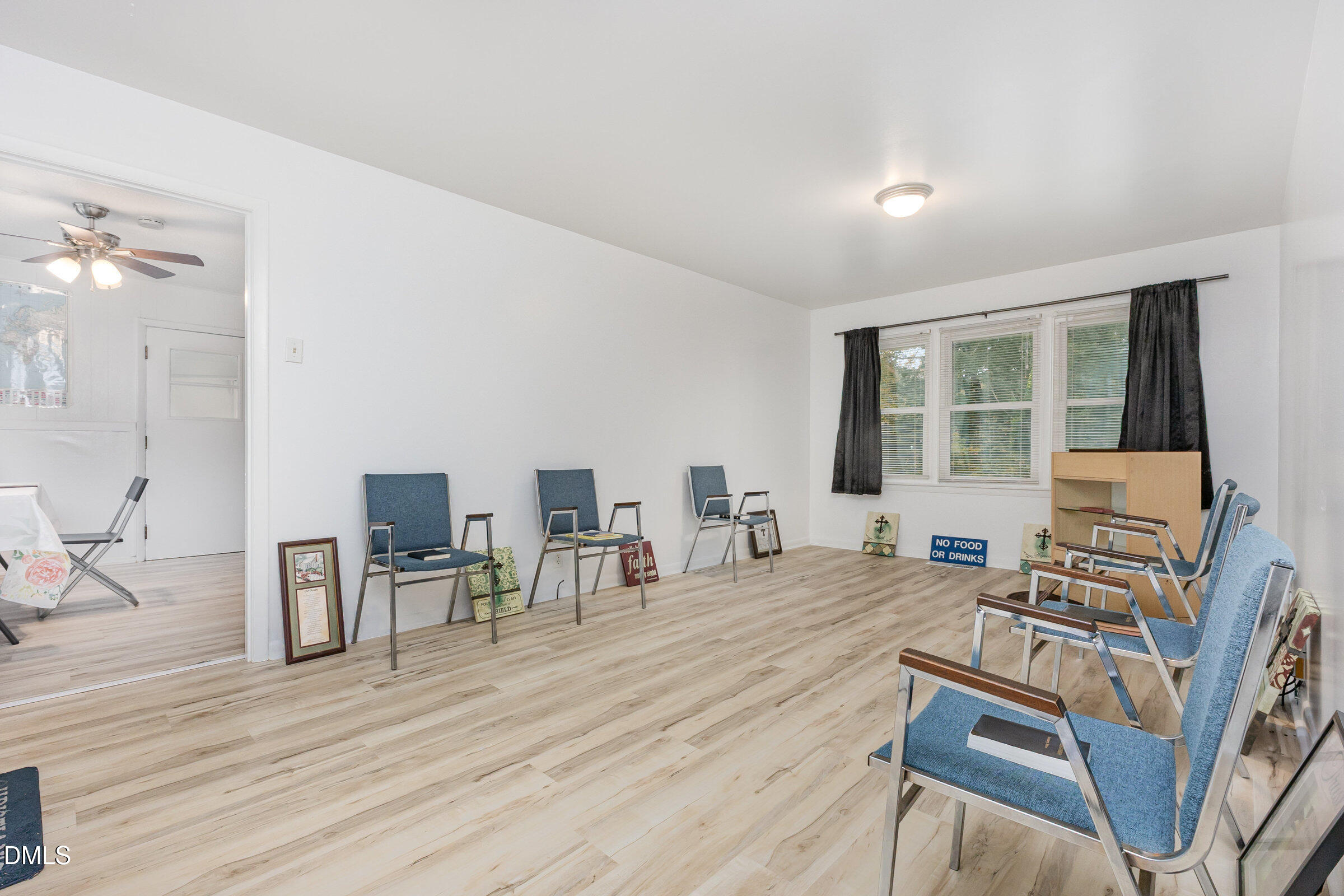 3228 Julian Drive Raleigh, NC 27604 - Photo 6 of 29 a room with furniture and a wooden floor