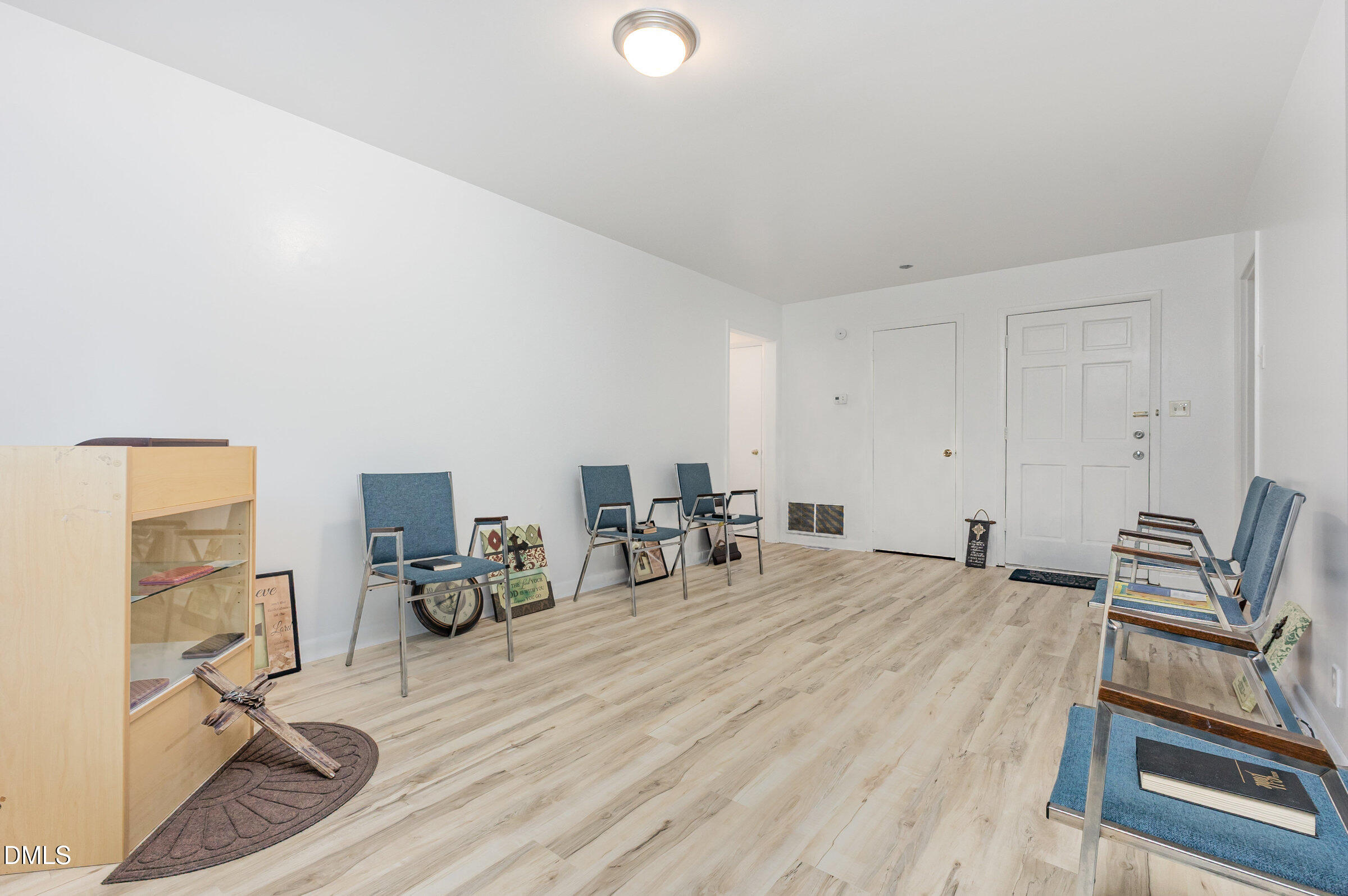 3228 Julian Drive Raleigh, NC 27604 - Photo 7 of 29 a room with furniture and a wooden floor