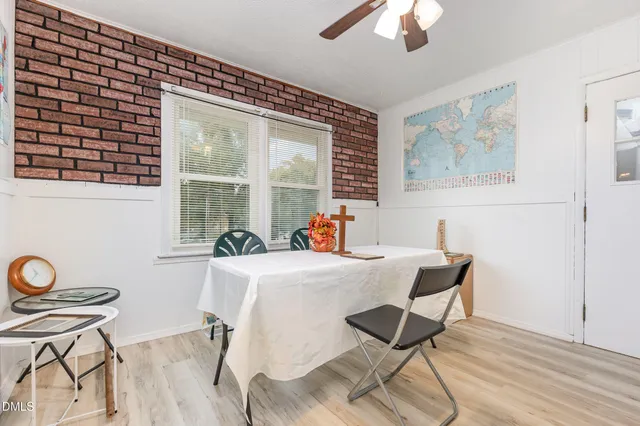 a dining room with furniture and window