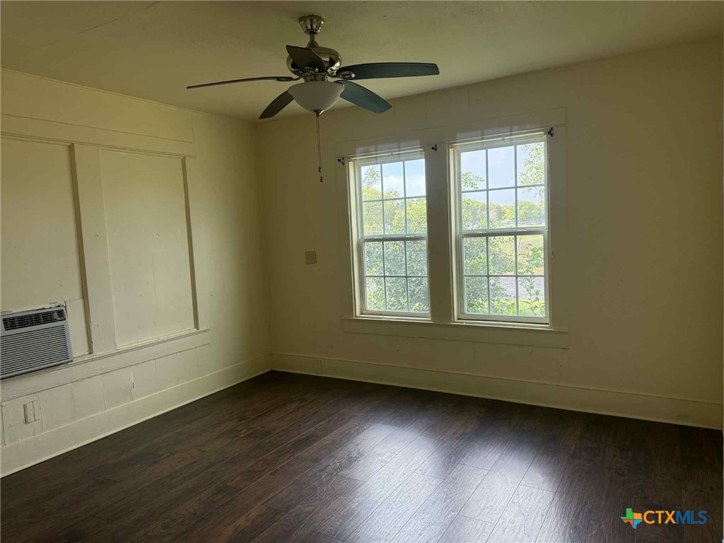 3003 Morgan Drive Victoria, TX 77901 - Photo 5 of 10 a view of an empty room with wooden floor and a window
