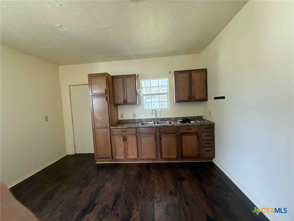 3003 Morgan Drive Victoria, TX 77901 - Photo 8 of 10 a kitchen with stainless steel appliances granite countertop a stove and a wooden floors