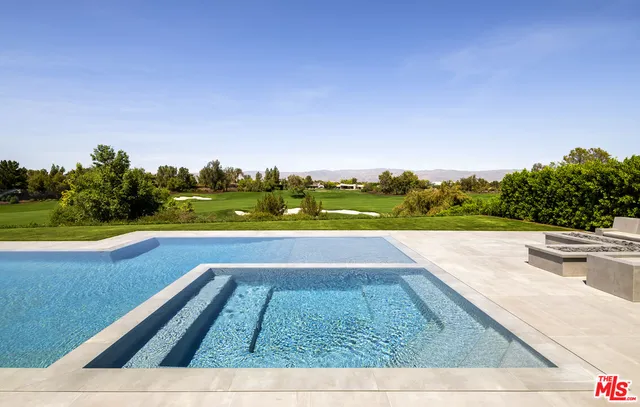 a view of swimming pool from a balcony
