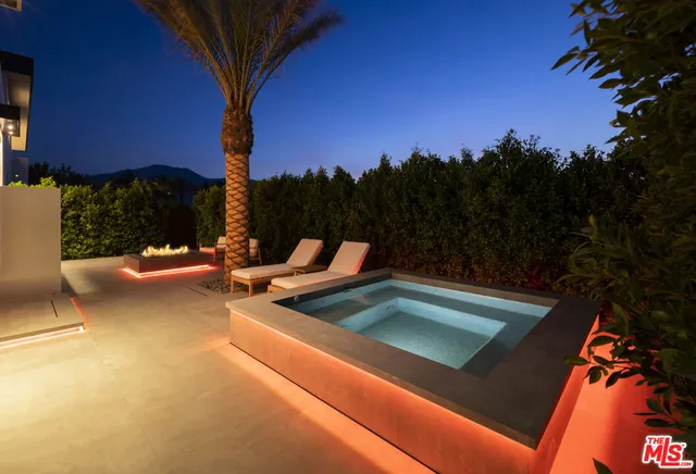 a view of a patio with a table under an umbrella